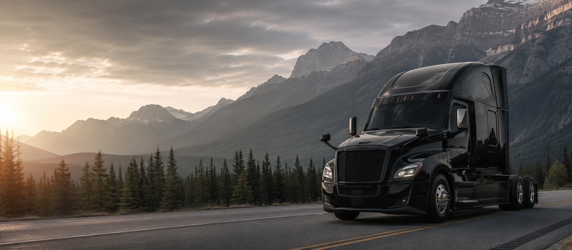 Black semi truck on a Canadian mountain highway